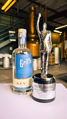 Best Gin / White Spirit of the Year: Griffo Scott Street Gin with ASCoT Statuette, awarded by the American Spirit Council of Tasters. In the background is 'Betty', Griffo's customized Vendome copper still which Head Distiller, Dr. Mike Griffo, operates with his own proprietary software for higher control, consistency, and quality.