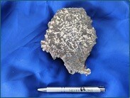 2 (b) Right: 459,000 g/t silver (13,385 oz/t) vein fragment containing abundant visible native silver. This sample is not necessarily representative of the mineralization hosted on the property. (PRNewsfoto/Silver One Resources Inc.)