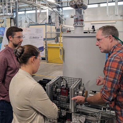 Colin Heye and Kayla Rajsky (from left) of Interlune at Pacific Northwest National Laboratory collaborating with Corey Archipley (right) on novel methods of liquefying helium using the magnetocaloric effect