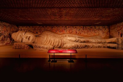 Cave 158, a renowned Nirvana cave in the Mogao Caves, features a 15.8-meter-long Buddha statue with a serene expression and a slight smile. (PRNewsfoto/Shanghai Municipal Administration of Culture and Tourism)