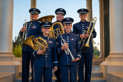 The two trumpet players, horn player, trombone player, and tuba player who comprise the US Air Force Band of the Golden West's brass ensemble, Travis Brass, pose together.