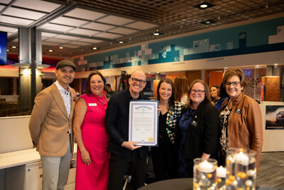 Nikola Danaylov, keynote speaker and futurist; Theresa Rich, Mayor of Farmington Hills; Mark Bellissimo, CEO of the JRT agency; Samantha Steckloff, State Representative, 19th District; Kelly Breen, State Representative, 21st District; and Gwen Markham, Oakland County Commissioner, District 15, present the State of Michigan Special Tribute honoring JRT’s 50th anniversary at the "50 Forward" celebration, recognizing its contributions to Farmington Hills, Oakland County, and Michigan.