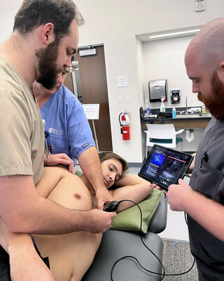 Medical students utilizing Butterfly ScanLab training application during KCU ultrasound workshop