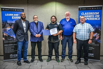 Native American student Camron Slaton (center) of Oklahoma State University Institute of Technology in Okmulgee, Oklahoma, is a recipient of one of three Mopar Career Automotive Program (CAP) scholarships. Shown in a recent ceremonial event, Slaton will receive up to $20,000 reimbursements for necessary tools and two years of tuition to become an automotive service technician. Shown from left to right: D’Ondre Cyrus, Mopar CAP Relationship Manager, Central and South Regions; Cecil Williams, Area Technical Training Manager; Camron Slaton, Scholarship Recipient, Crown Auto World, Bristow, OK; John Prior, Oklahoma State University Institute of Technology Mopar CAP Instructor; Mark Gibble, Oklahoma State University Institute of Technology Mopar CAP Instructor