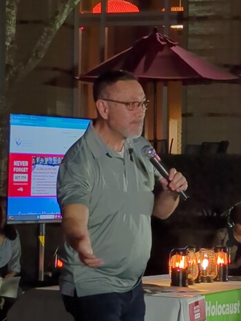 Dr. J. Doug Stringer leads the participants in an interfaith prayer