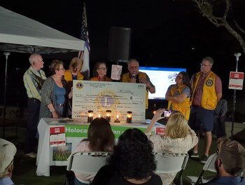 The Humble Noon Lions Club presented a donation of $2000 to get the Upstander Stones Project into local classrooms