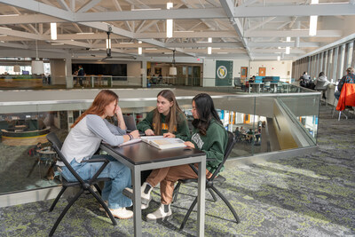 Three young women study in Clarkson University’s Educational Resources Center