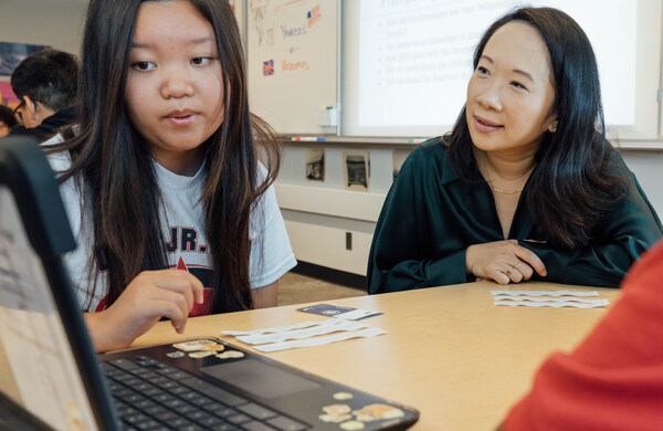 CZI’s Head of Education, Sandra Liu Huang, observes students using an AI tool.