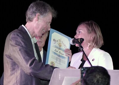 Internet Brands CEO Bob Brisco receives an Outstanding Community Service Award from LA Councilwoman Traci Park at West Coast Care’s fundraising gala on Oct. 10, 2024