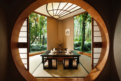 The traditional Japanese seating, combined with a serene view of the lush garden, creates a peaceful ambiance that transports guests into a Zen-like setting. Large windows allow natural light to fill the space, enhancing the connection to nature, while the calming garden view serves as the perfect backdrop for savoring exquisite Japanese cuisine in a private, relaxing environment.