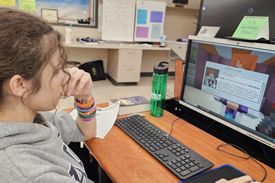 Student in the classroom using Cyber in Minecraft