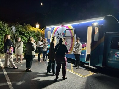 Princeton students stand outside the Options for Her state-of-the-art mobile medical clinic, complete with a women’s exam room and ultrasound.