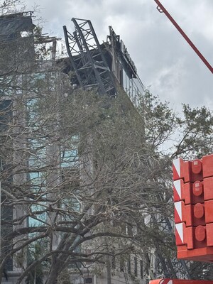 A construction crane is pictured after falling over into an office building that houses the Johnson Pope Law firm during Hurricane Milton, Thursday, Oct. 10, 2024 [Nicholas Alsaka | Johnson Pope]