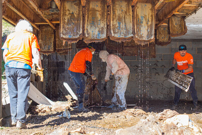 Bandwidth volunteers removing waterlogged insulation for a homeowner impacted by Hurricane Helene in Ashe County Oct. 9, 2024.