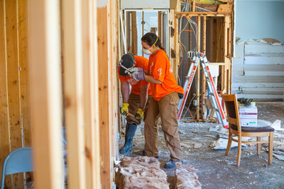 Bandwidth volunteers removing waterlogged wallboard for a homeowner impacted by Hurricane Helene in Ashe County Oct. 9, 2024.