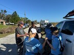 Hope Force Reservists pray with hurricane survivors.