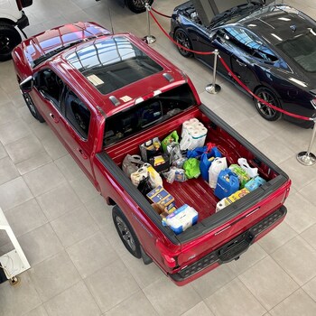 A Ford truck filled with food donations