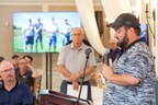 John Silva speaks at the Benchmark One Company Fund Golf Tournament with Tom Grape, Benchmark's chairman and CEO looking on