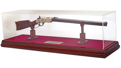 The highly collectible rifle features hand-chased engraving on both sides of its brass receiver, exhibition-grade American walnut, and includes a hand-built tabletop display.