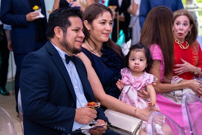 Keily, the first child to undergo surgery at Kenneth C. Griffin Surgical Tower is joined by her parents during the opening celebration.