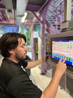 Hello Bello employee, Daniel, working the line terminal