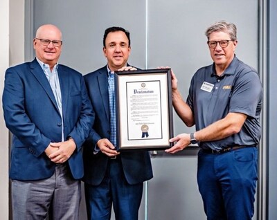 (From left) Mark Tester, Orange County Convention Center executive director; Steve Prahalis, chief operating officer at SME; and Edward Youdell, president/CEO of the Fabricators and Manufacturers Association, hold the proclamation of FABTECH Week from the Orange County mayor.