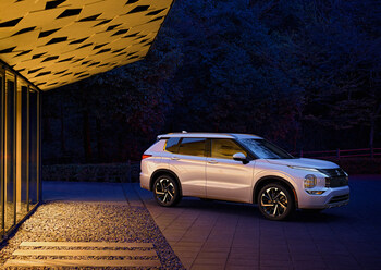 2024 Mitsubishi Outlander Parked Outside of a Modern Building