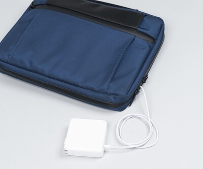Dual zippers and cut-outs in padded laptop compartment allow in-case charging.