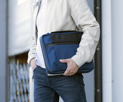 Flexible carry options: tuck the Tech Folio under an arm, hold it by the ergonomic handle, or sling it over a shoulder with an optional strap.