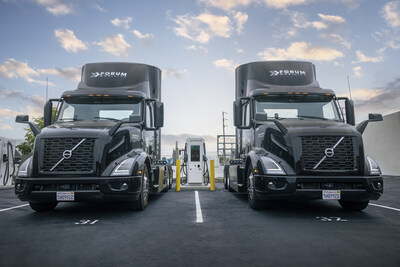 Forum Mobility electric trucks at a charger