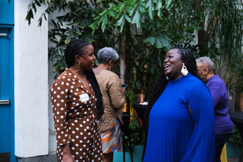 Diamond Lee speaks to Dana Sherrod, MPH, Co-Founder and Executive Director of CA Coalition for Black Birth Justice at 'Birth Justice and Joy" Event in Los Angeles; Photo courtesy of CCBBJ