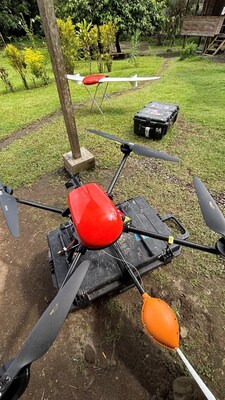 Geoscan’s 401 quadcopter drone with the Geoshark magnetometer, and fixed wing UAV (on stand) capturing high-resolution orthomosaic imagery and topography. (CNW Group/Adyton Resources Corporation)