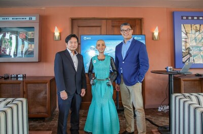 The photo features Taichi Hiramatsu, Chief Executive Officer, Hong Kong, NTT Com Asia (left), Sophia, the social humanoid (middle), and Stephen Tsang, Chief Revenue Officer, NTT Com Asia (right).