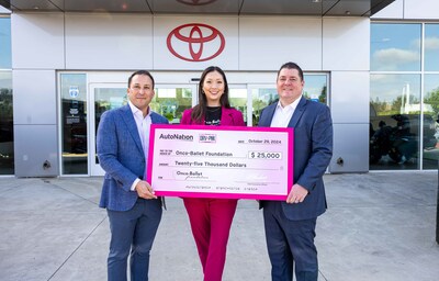 AutoNation's Arturo DiazGonzalez (left), General Manager of AutoNation Toyota Irvine, and Mark LeCompte (right), Southern California Market President, join Anna Wassman-Cox, founder of Onco-Ballet Foundation, in celebrating AutoNation's $25,000 donation to the foundation.