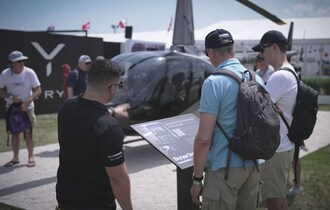 Skyryse One surrounded by attendees at the 2024 EAA AirVenture show in Oshkosh, Wisconsin.