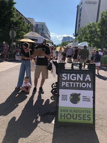 A Denver family signs a petition to put the slaughterhouse ban on the ballot. Over 15,000 signatures were submitted to the city.