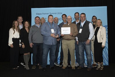Right! Systems team members Cary Dahl, Greg Semler, Andrew Sherman, and Neil Smith, pictured centered from left to right, accepted the Regional Partner of the Year: Golden Northwest award. They are surrounded by supporting Cisco team members at the 2024 Cisco Partner Summit in Los Angeles, CA.