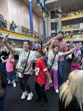 Taylor Swift appeals to multiple generations making it a real family affair and kids and their grownups dance and sing the lyrics to her songs at the world's largest children's museum.