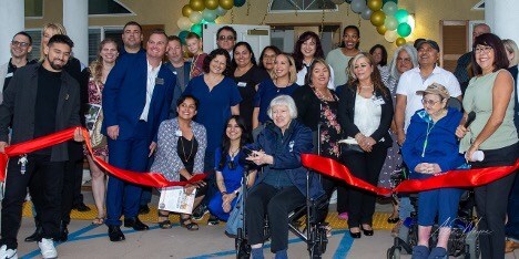 Sunlit Gardens Senior Living celebrates over 20 years of service with a joyful ribbon-cutting at their Grand Reopening event.