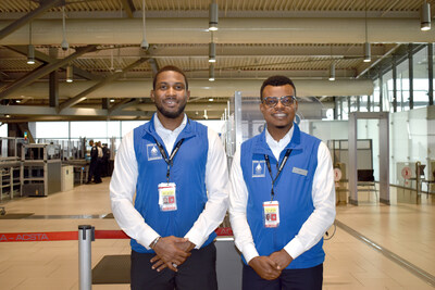 Two Facilitators standing in front of a CATSA Checkpoint (CNW Group/Canadian Air Transport Security Authority (CATSA))