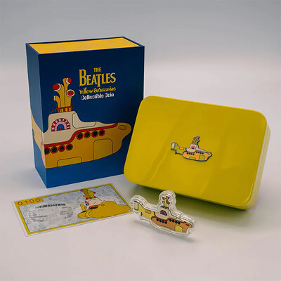 Silver Yellow Submarine collectible with case, box, and certificate