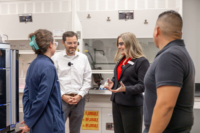 Laura Bray, founder and Chief Change Maker at Angels for Change, discusses critical quality control processes for Dextrose injection solutions with Fagron Sterile Services US analytical lab employees at a state-of-the-art 503B outsourcing facility. (PRNewsfoto/Angels for Change,Fagron Sterile Services US)