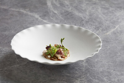 Confit pork jowl, Fremantle octopus, pickled straw mushrooms, white kombu, choko shoots and ‘nước mắm’–one of the dishes that clearly showcases Chef Sam Aisbett's creativity and his ability to combine ingredients without any limit (PRNewsfoto/Akuna Restaurant)