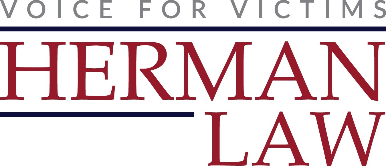 Logo of Herman Law, a firm dedicated to advocating for victims, featuring the tagline ‘Voice for Victims’ in gray above ‘Herman Law’ in bold red text with navy blue accent lines.