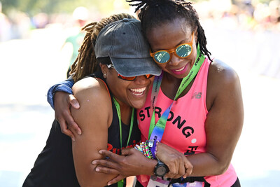 Alison Mariella Désir celebrates finishing Every Woman’s Marathon. Credit: MilkPEP