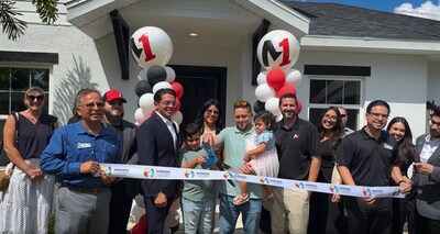 Pedro preparing to cut the ribbon surrounded by his family, Jason James, Pedro Turushina, Jonathan Amador, and various members of the Hispanic Chamber of Metro Orlando.