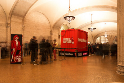 Captain Morgan, joined by Cruz and Dillane, gave the public a sneak peek of its crewneck in NYC, where a massive shipping container landed on the concourse of one of the busiest commuter stations in the world. (PRNewsfoto/Captain Morgan)