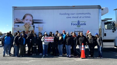 Smithfield Foods employees volunteered at the Mayflower Marathon Holiday Food and Fund Drive by unloading donations, organizing food items and lending an extra hand to event organizers.