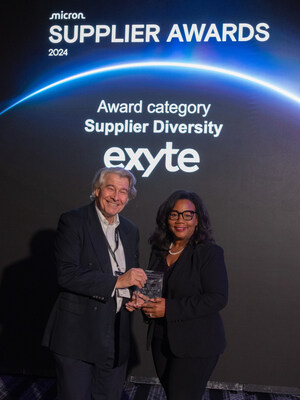 Exyte CEO Wolfgang Büchele receives the award from Fran Dillard, Micron's Chief Diversity Inclusion Officer.