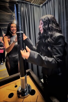 Dua Lipa Cheers on Cher as Cher signs an Aroma360 SPKR XL